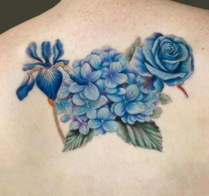 Blue flower tattoo